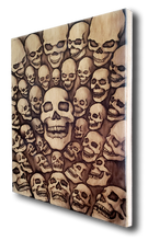 40 Skulls (wood print | black on a wood background)